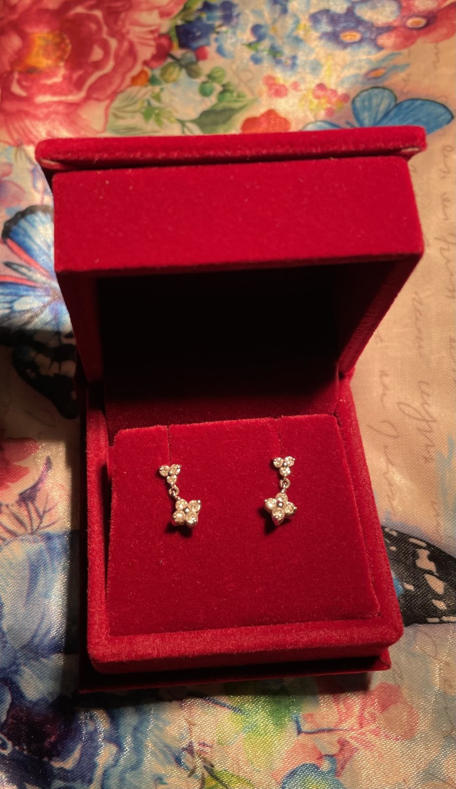 Platinum dangle style earrings with diamonds